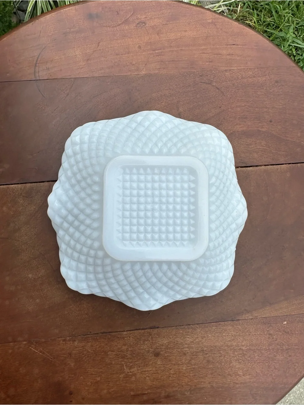Milk glass dish in diamond pattern with scalloped edge